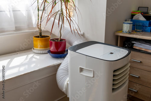 Side view of a portable air conditioning unit.