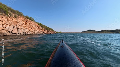 Immersive POV from a kayak - paddling on windy Horsetooth Reservoir in Fort Collins, Colorado, summer morning scenery 