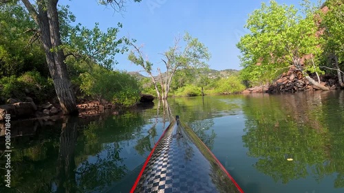 Immersive POV from a kayak - paddling in a canyon of Horsetooth Reservoir in Fort Collins, Colorado, summer morning scenery 
