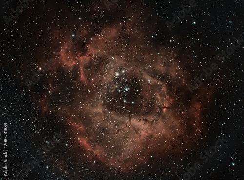 Deep space telescope view of a red cosmic emission nebula