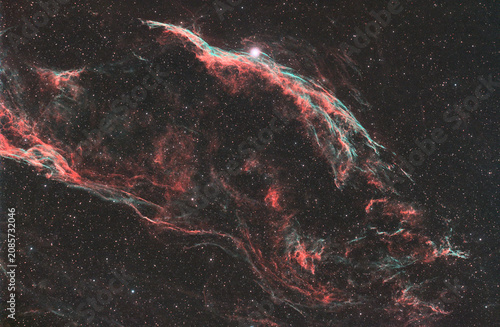 Deep space telescope view of a red cosmic emission nebula