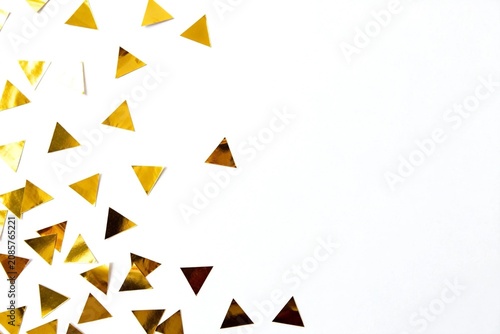 Golden Triangle Confetti on White Background