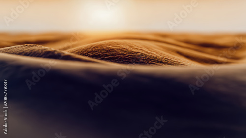 Golden sand dune landscape sunset with soft ripples and warm light evoking calm and solitude