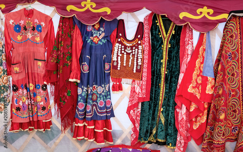 A display of traditional Central Asian textiles and clothing.