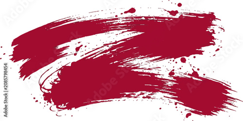 Red brush stroke with splatters on white background for design