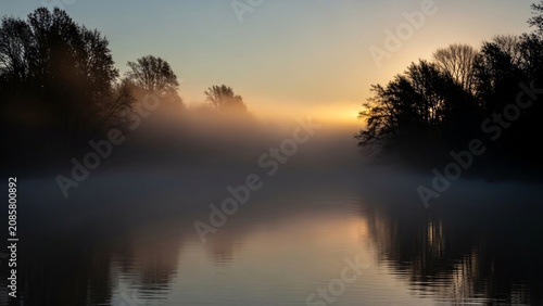 Sunrise over serene lake