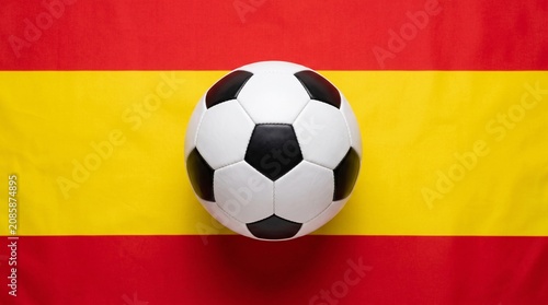 Classic Soccer Ball Centered on Spanish Flag Fabric with Red and Yellow Stripes
