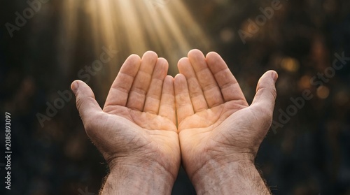 Open Hands Receiving Light Symbolizing Surrender and Forgiveness