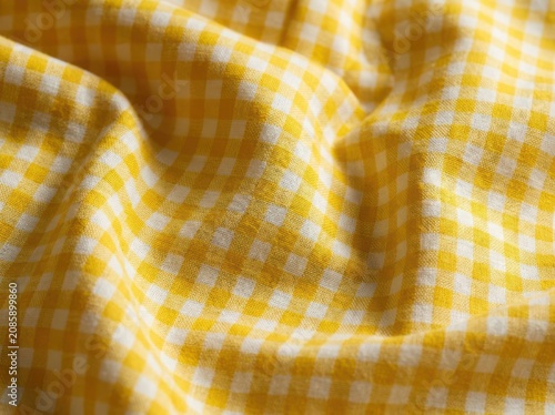 Textured yellow gingham fabric cloth pattern with checkered material geometric
