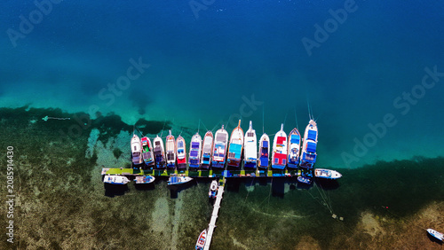 Aerial views of the coastal area off Bademli Neighborhood in Dikili, İzmir, Turkey, featuring Kalem Island, Garip Island, Aquarium Bay, Pissa Bay, and Hanımın Bay.