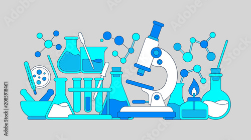 Scientific laboratory equipment with microscope and flasks.