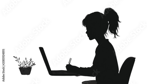 Student writes in a notebook while utilizing a laptop at a table decorated with a small plant to complete academic assignments in a peaceful and well organized home office setting for learning.