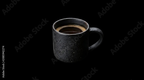 Black textured ceramic coffee mug with dark espresso isolated on black 202606141432