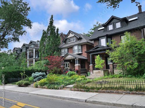 Photography street of older brick houses with dormer windows