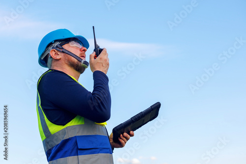 Canvas Print Engineer technician inspectoror or utility worker wearing blue hard hat, holding