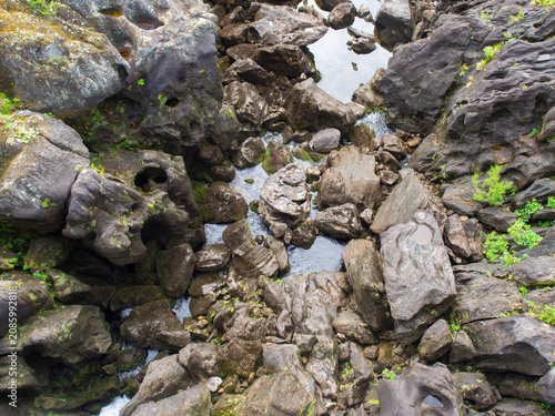 Konstfotografi Aerial view of a rocky riverbed with volcanic stones and pools