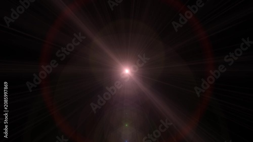 A dramatic lens flare effect with shining light rays, glow, and radiant spots across a dark background