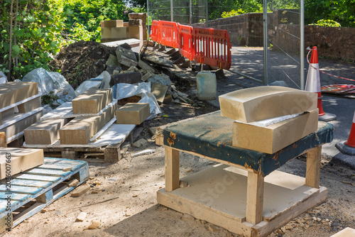 Tableau sur toile Sandstone bridge coping stones prepared for historic bridge restoration
