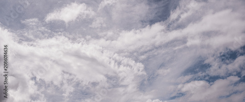 Cloudscape cirrus clouds blue sky wispy clouds creating peaceful atmospheric background with soft natural light and spacious copy space