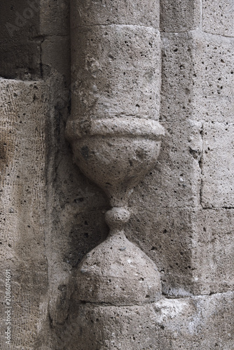 Stone column hourglass-shaped baluster of sandstone wall historic architecture carved stone showcasing classic craftsmanship and authentic architectural texture