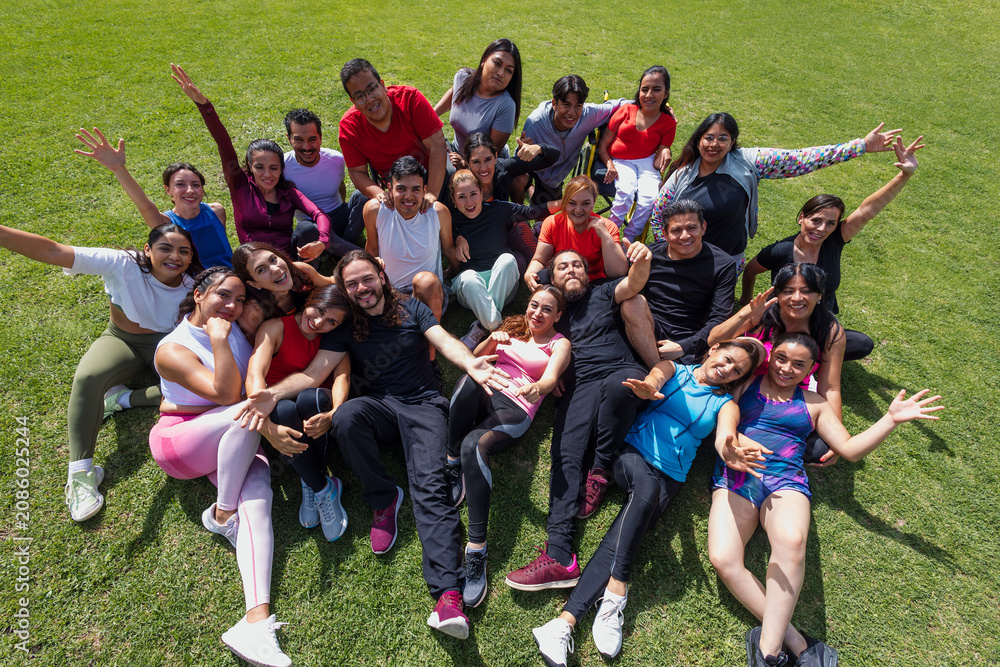 Fototapeta premium portrait of Latin sporty group of people after training workout outdoors in Mexico Latin America, large and diverse group of hispanic people of different ages and multi age