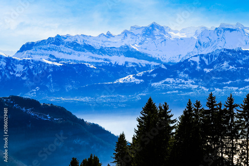 Unique panorama skyline view of snow-capped mountains over lake Lucern Switzerland