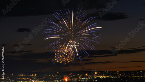 Fireworks over the Rio Grande Valley for the 250th birthday of the USA near Albuquerque New Mexico at sunset