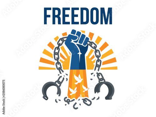 Fotografie Raised fist breaking iron chains and handcuffs symbol of liberty