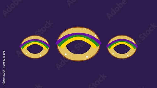 Three Floating Mardi Gras King Cake Donuts With Colorful Icing