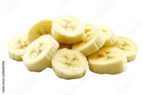 Fresh ripe banana slices arranged in a pile on black background bananas sliced
