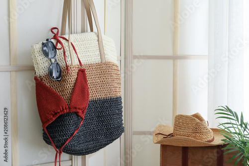 Canvastavla Beach accessories hanging on wall with straw hat on wooden box