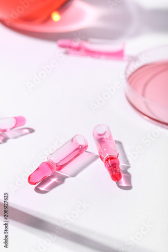 Glass ampoules on light bac...