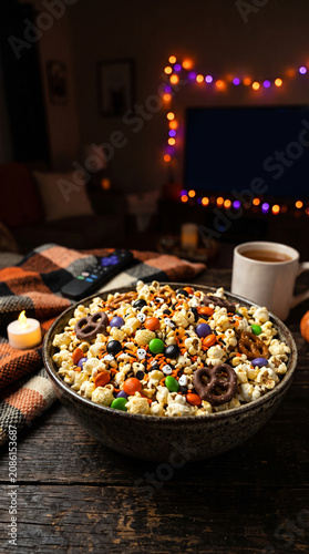 Halloween Popcorn Mix Bowl with Festive Decorations and Cozy Atmosphere