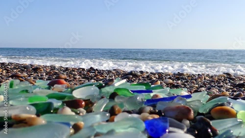 Sea glass, Pieces of sea glass isolated on white background, Green pieces of glass polished by the sea closeup background. A pile of natural beach glass, Multi colored pieces of polished glass. Colore
