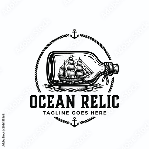 Fotografie Vintage ship glass bottle with rope frame anchor for ocean relic nautical explor