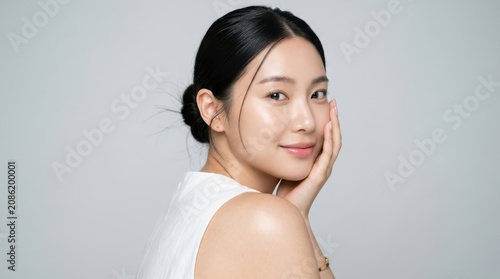 Portrait of a beautiful young asian woman with glowing skin