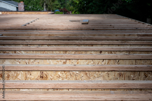 Obraz na plátně Wood i-beam floor joists installed at new home build, OSB oriented strand board,
