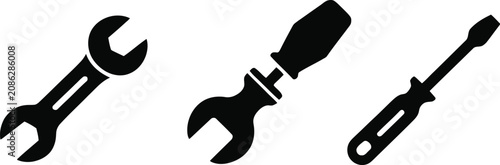 Mechanic hand tool icons featuring open-end wrenches, flathead screwdriver, adjustable spanner, and repair equipment in black silhouette vector style.