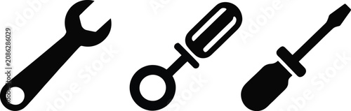 Mechanic hand tool icons featuring open-end wrenches, flathead screwdriver, adjustable spanner, and repair equipment in black silhouette vector style.