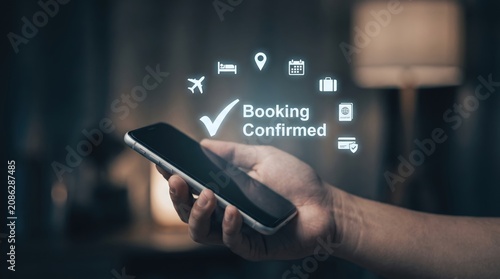 Side Angle Hand Holding Smartphone with Booking Confirmed Holographic Interface, Showcasing Digital Travel Reservation, Mobile Booking Confirmation, Smart Tourism Technology, Online Trip Planning 
