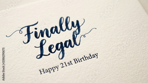 Finally Legal Happy 21st Birthday greeting card, elegant blue calligraphy on white textured paper, celebratory milestone birthday message