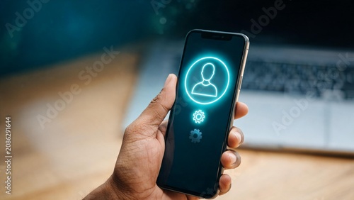 Hand holding smartphone displaying glowing user profile and settings icons for digital identity and account management