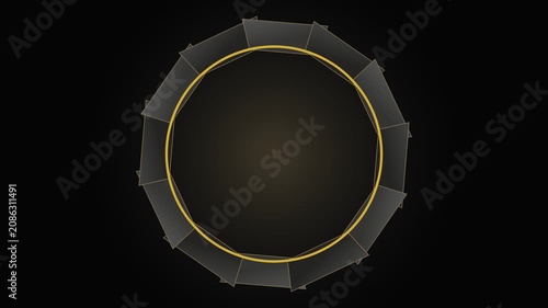 Macro top view of a geometric black and gold professional studio light modifier on a dark background