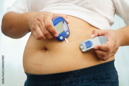 Photos Asian woman injecting herself diabetes injecting insulin in stomach at home