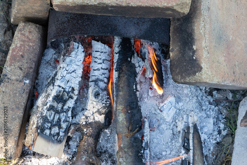 Tableau sur toile Backyard Fire Pit With Burning Firewood Inside a Makeshift Brick Stove Outdoor C