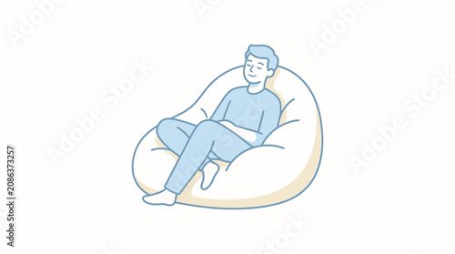 Foto Man sitting on bean bag chair.