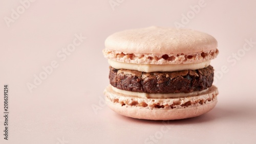Pink macaron cookie sandwich with brownie and cream filling