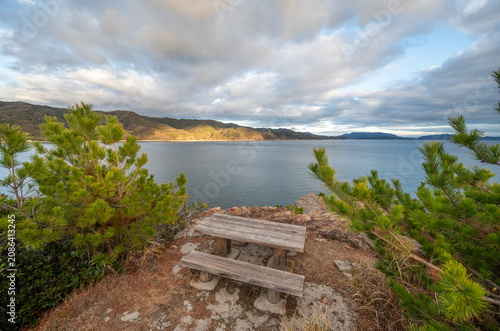 A wooden picnic table overlooking the Seto Inland Sea