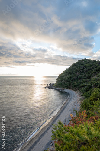 Sunset over the Seto Inland Sea along a rugged coastline