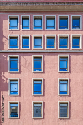 Barcelona, Symmetric Windows on Pink Building Facade, Modern Geometric Architecture, Minimalist Urban Apartment Exterior